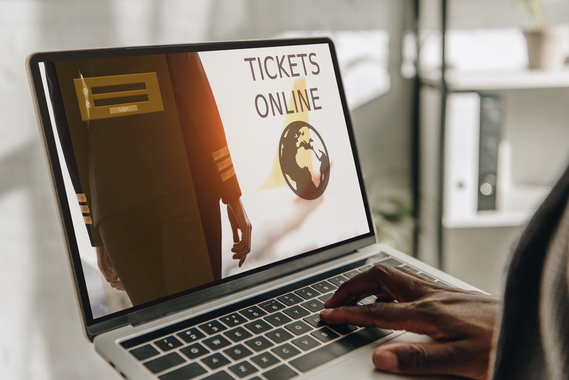 cropped view of african american businessperson using laptop with online tickets website on screen